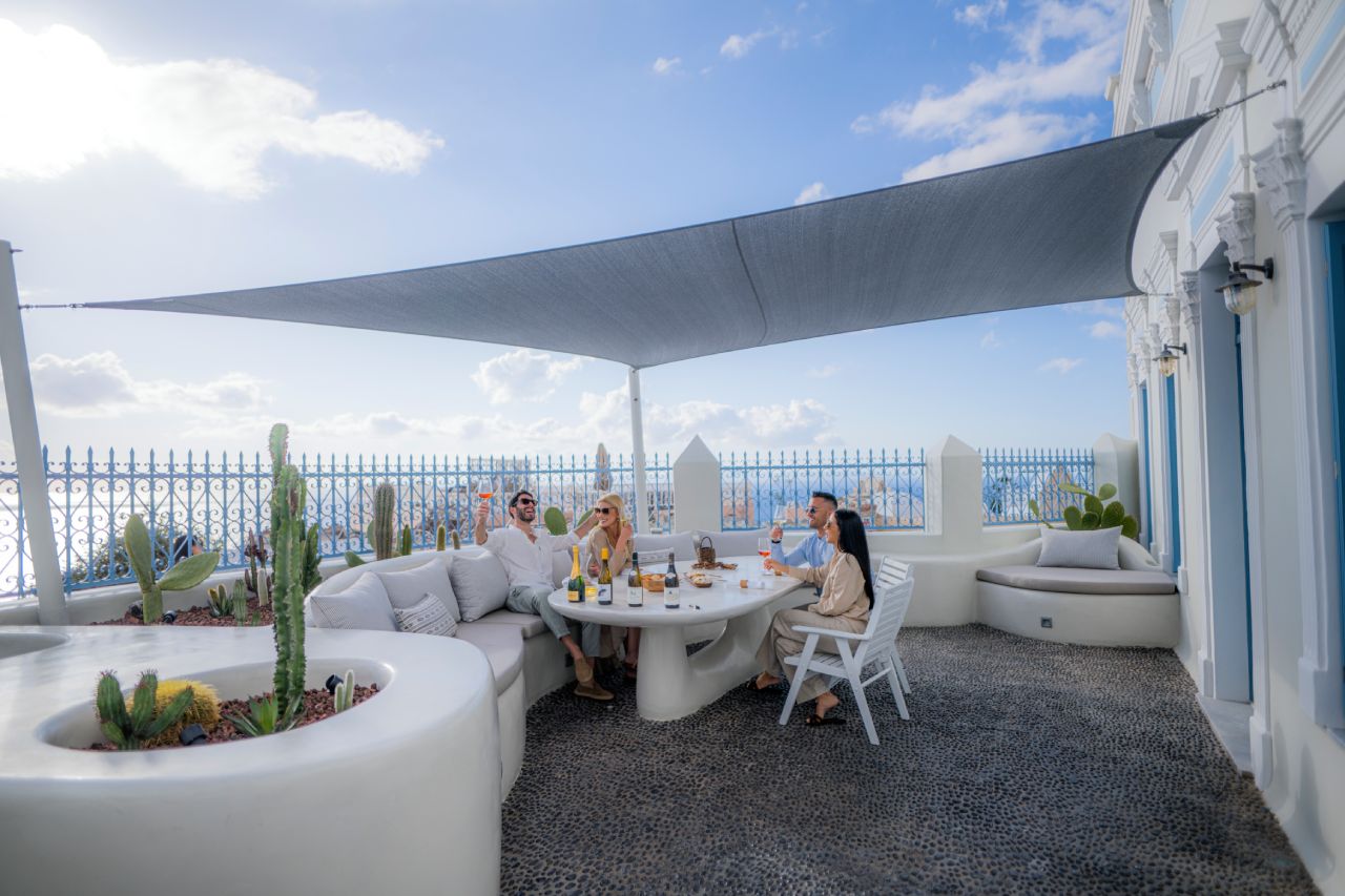 Oia Mansion - Luxurious Mansion rental in Santorini - Front Yard Wine Tasting with company
