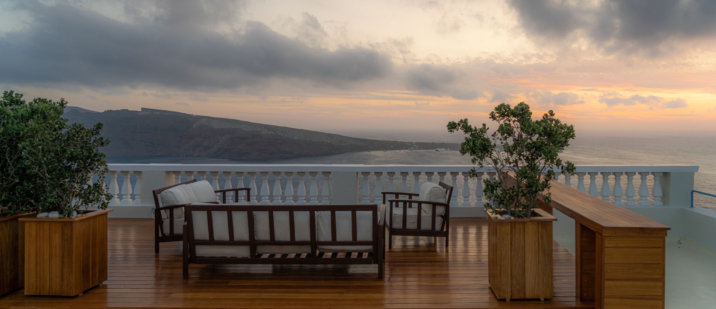 Relaxing on the Terrace enjoying the another Beautiful Sunset over the Caldera - Oia Mansion - Luxurious 4 Bedroom Mansion Rental in Santorini
